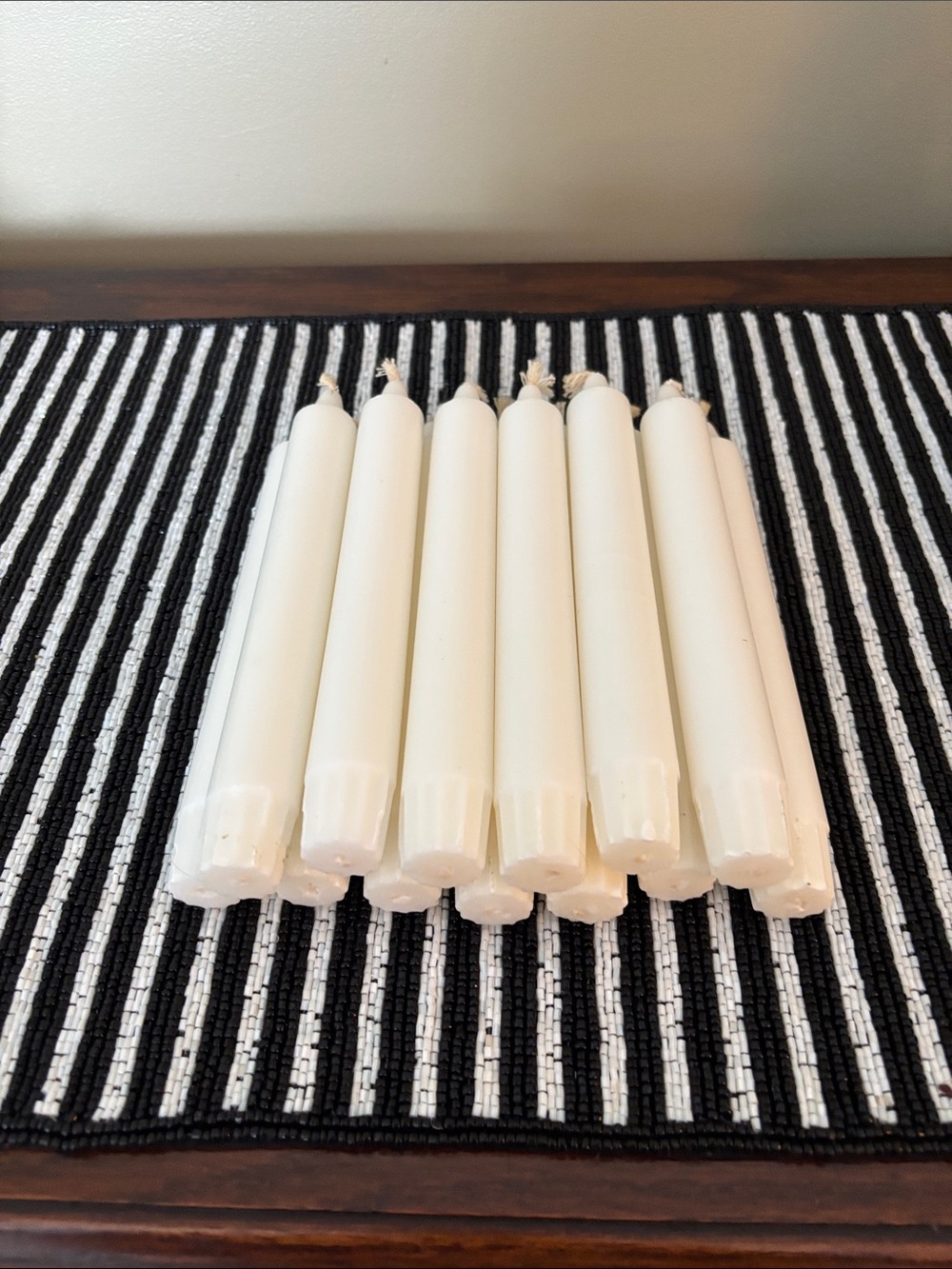 Bundle of 12 white taper candles with ribbed self-fitting ends